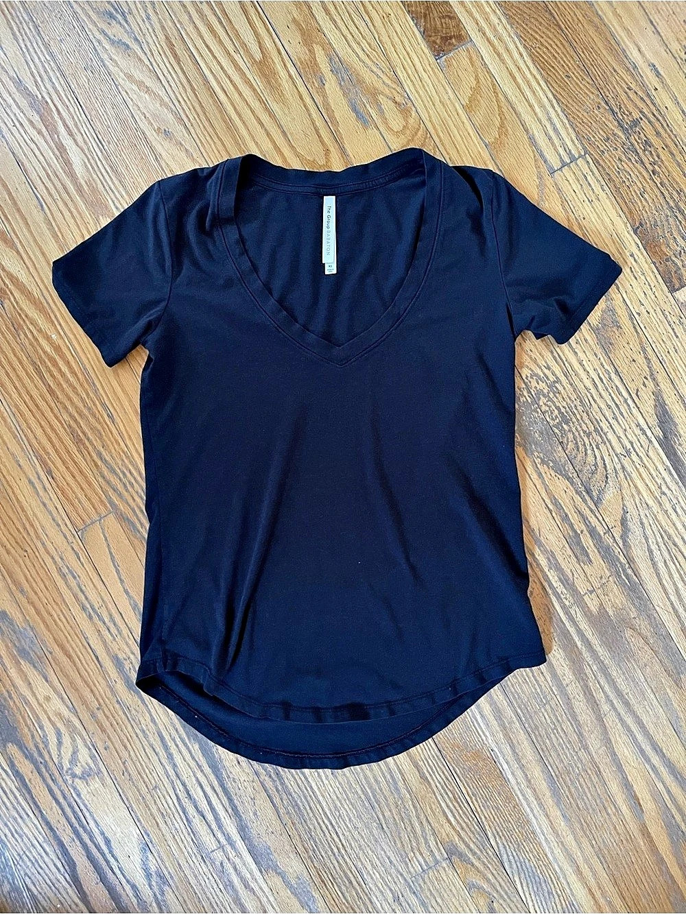 The Giving Movement V-Neck Short Sleeve Tee in Black & White